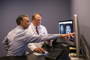 Radiology experts going over a scan